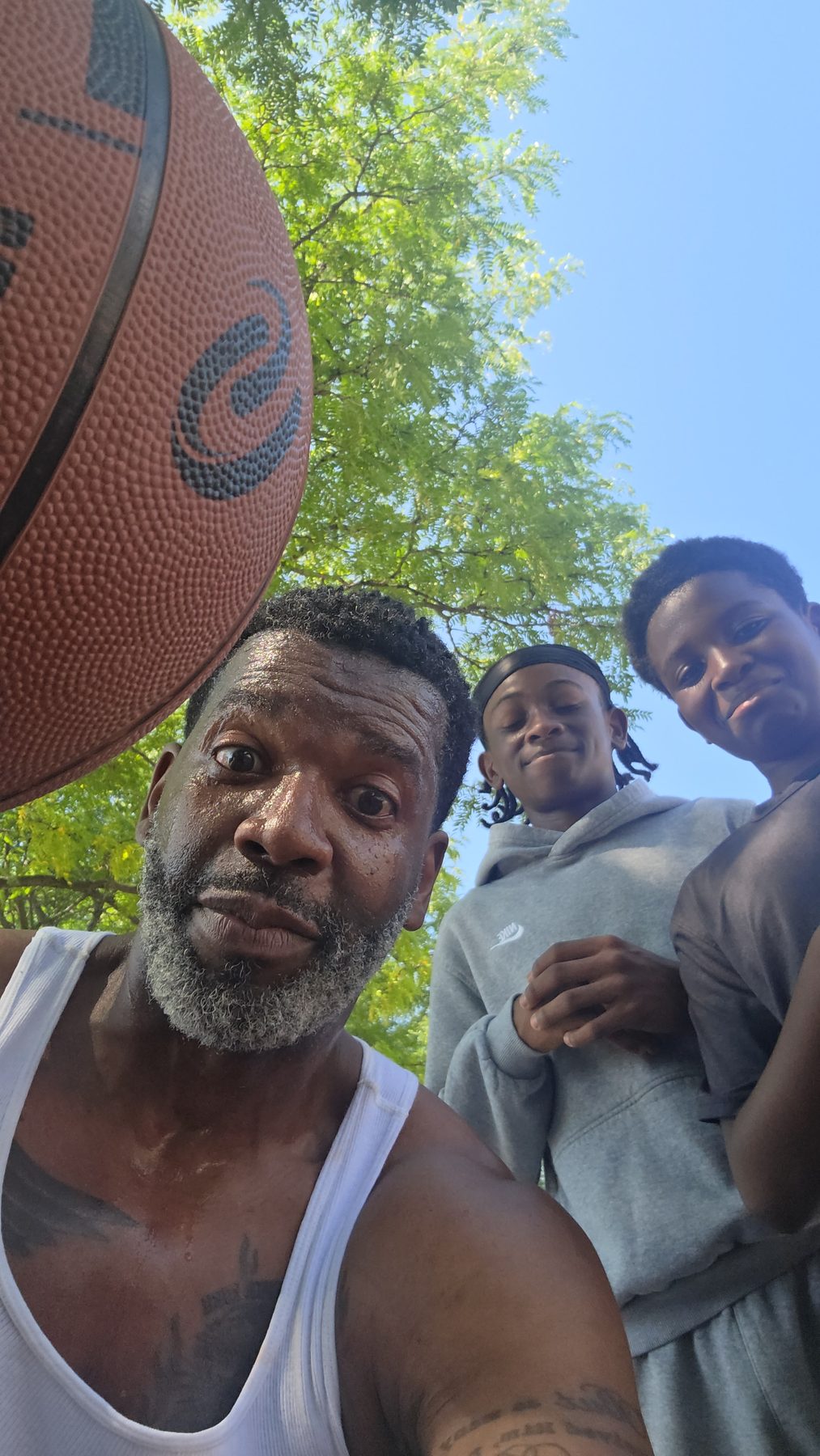 Kingdom 12 players and their mentor together after a game
